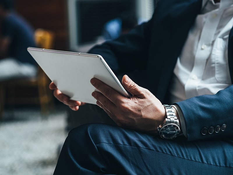 Business-man-hands-holding-tablet-stock-photo